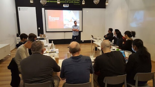 Patrick teaching students about UX writing and the importance of UX content photo